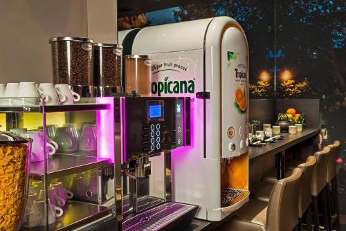 a coffee machine sitting on top of a counter at Midnight Hôtel Paris in Paris