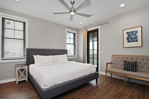 a bedroom with a bed and a ceiling fan at Gin Fizz by Pristine Properties Vacation Rentals in Port Saint Joe