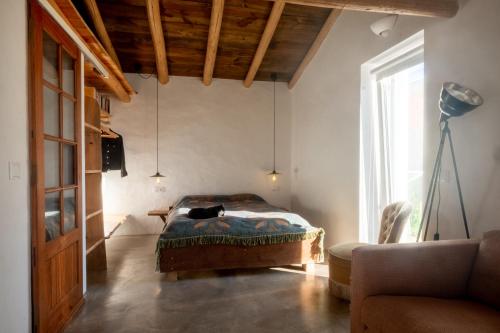 En eller flere senge i et værelse på Monte Paxôra