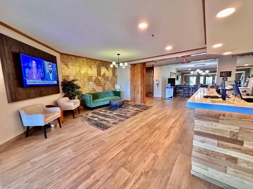 a lobby with a living room and a waiting area at SureStay Plus by Best Western Fremont I-69 in Fremont