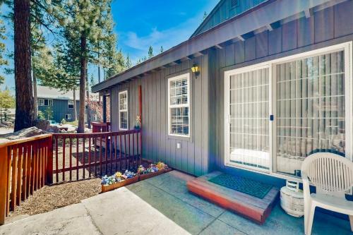 a tiny house with a porch and a balcony at Little Pinecone Retreat in Truckee