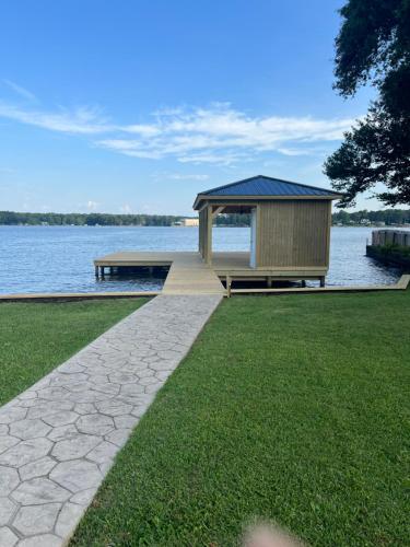 a gazebo on the shore of a lake at Luxury Lakefront property in Milledgeville