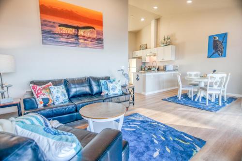 a living room with a couch and a table at Ocean View & Whale Watching! Spouting Horn Three in Depoe Bay