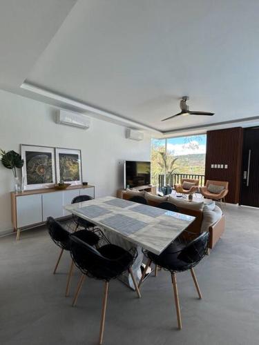 a living room with a table and chairs at Vista De Montana Private House in Nasugbu