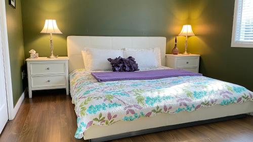 a bedroom with a large bed with two night stands at Warm home in Richmond