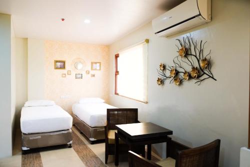 Кровать или кровати в номере Level 007 Hotels and Resorts Inc