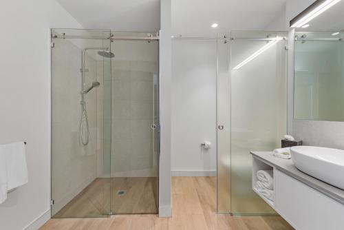 a bathroom with a shower and a sink at Peppers Silo Launceston in Launceston