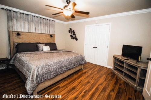 a bedroom with a bed and a ceiling fan at “Home Away From Home” ( HAFH) in Baton Rouge