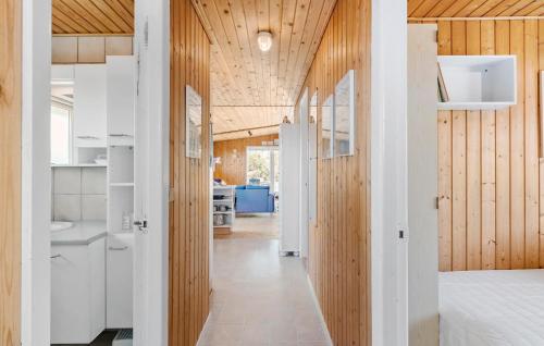 a hallway of a house with white walls and wooden ceilings at Gorgeous Home In Thisted With Wifi in Thisted