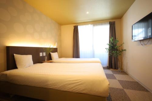 HOTEL THE POINT 清水五条にあるベッド