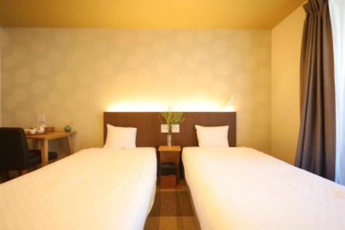 HOTEL THE POINT 清水五条にあるベッド