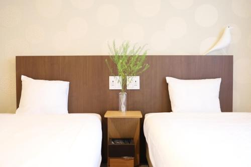 HOTEL THE POINT 清水五条にあるベッド
