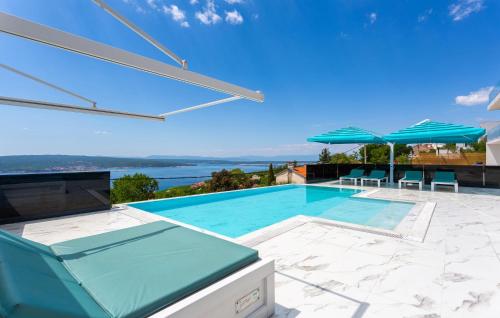 a villa with a swimming pool with a view at Gorgeous Home In Crikvenica With Sauna in Crikvenica