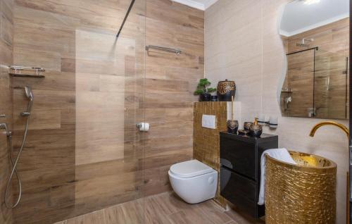 a bathroom with a toilet and a shower at Gorgeous Home In Crikvenica With Sauna in Crikvenica