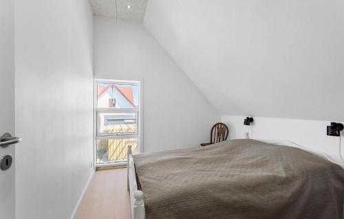 a white room with a bed and a window at 3 Bedroom Pet Friendly Home In Bagenkop in Bagenkop