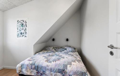 a bedroom with a bed in a white wall at 3 Bedroom Pet Friendly Home In Bagenkop in Bagenkop