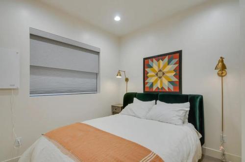 a bedroom with a white bed and a window at Alpine Mountain Escape in Beaver