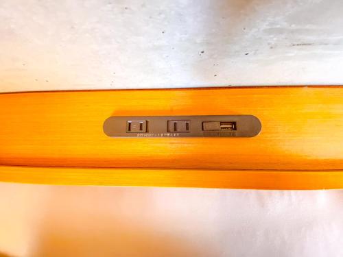a close up of a lightswitch on a wall at 「KIRAKU」Wood House稚内 in Wakkanai