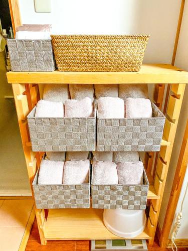 a shelf with four boxes of toilet paper at 「KIRAKU」Wood House稚内 in Wakkanai