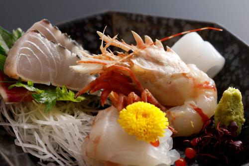 a plate of food with shrimp and rice at シーサイド佐竹 in Kyotango