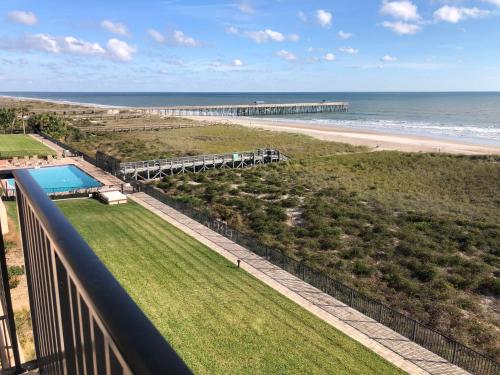 a view of the beach and the ocean from a balcony at The Pelican in Fernandina Beach