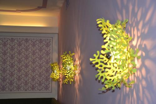 a bunch of green plants hanging on a wall at AKTIVHOTEL Weisser Hirsch in Mariazell