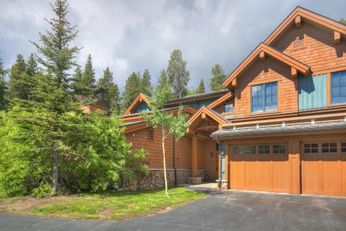 a large wooden house with a garage at Mountain Thunder Lodge in Breckenridge