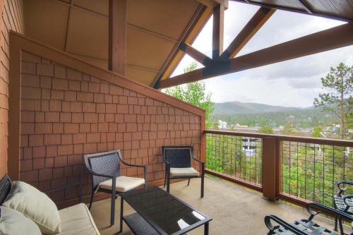a screened in porch with two chairs and a table at Mountain Thunder Lodge in Breckenridge