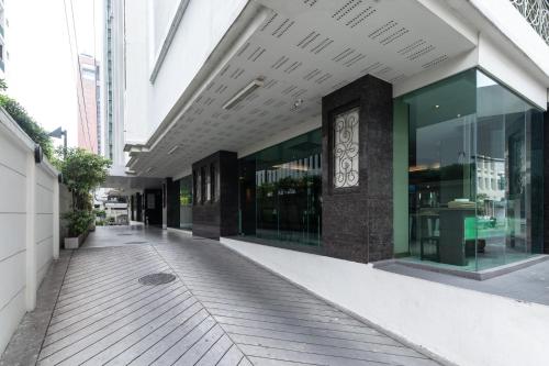 an empty sidewalk in front of a building at Admiral Premier Bangkok in Bangkok