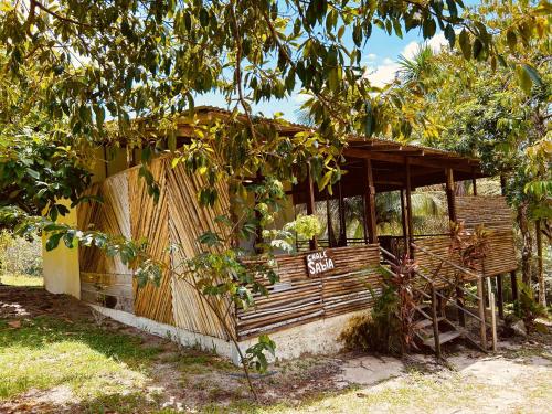 a small building with a sign on the side of it at Ponta Poranga Jungle Lodge in Manaus