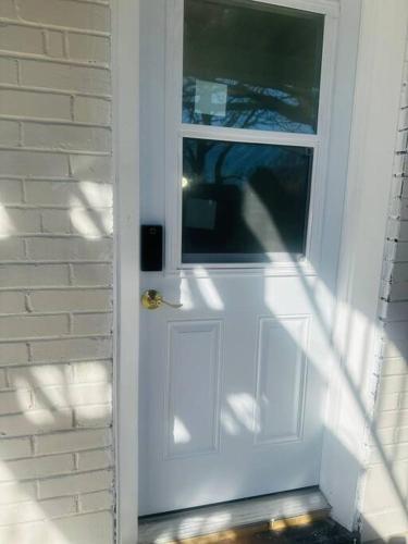 a white door with a window on a house at Newly renovated, laundry, separate entrance in Richmond Hill