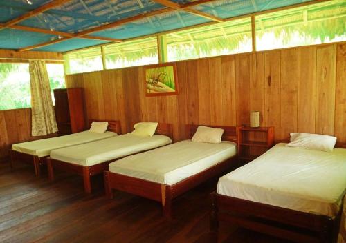 מיטה או מיטות בחדר ב-Curaka Lodge Expedition