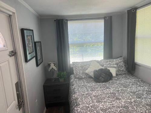 a bedroom with a bed and a window at Gold Star in Plant City