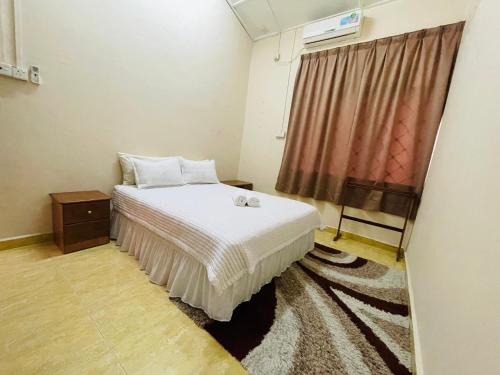 Postel nebo postele na pokoji v ubytování Kota Bharu Homestay