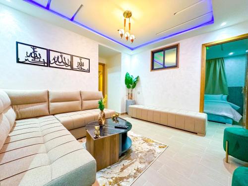 a living room with a couch and a table at VELUXA - LUXURY HOLIDAY HOMES - Centric flat in Tangier