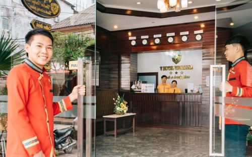a man standing in front of a restaurant at V Hotel Vientiane in Vientiane