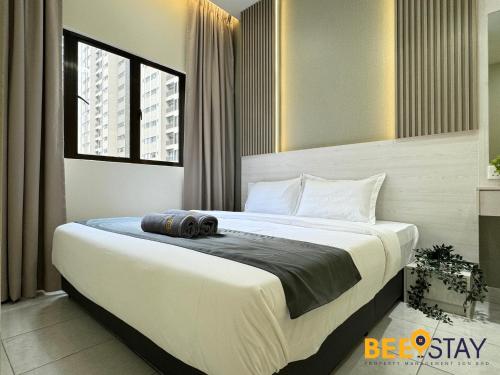 a bedroom with a large bed in a room at Youth City Residence Family Suite KLIA AEON Mall Nilai USIM in Nilai