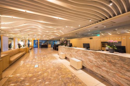 a hotel lobby with a reception desk at Shinjuku Washington Hotel Annex in Tokyo