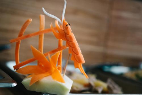 a toy shrimp on top of a piece of cheese at V Hotel Vientiane in Vientiane