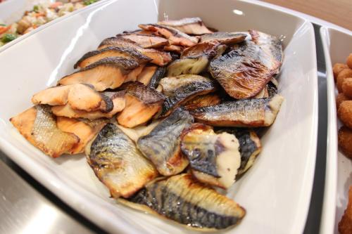 a plate of food with mussels and other foods at Castle Inn Toyokawa in Toyokawa