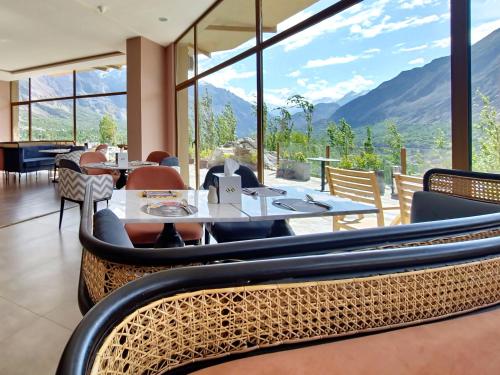 a restaurant with a view of the mountains at Ambiance Resort Hunza in Hunza