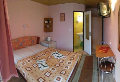 En eller flere senge i et værelse på Penzion Zelený Dom