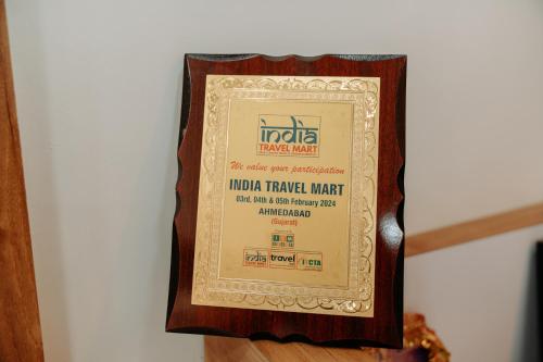 a framed picture of a nokia tamarisk match at Daksh Eden Greenz -A Luxury Resort in Sasan Gir in Sasan Gir
