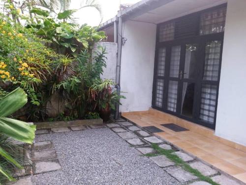 an outside view of a house with a door at Holiday Rental Mattegoda Sri Lanka in Mattegoda