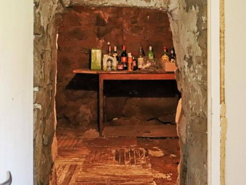 a room with a table with bottles on it at 6 person holiday home in HISHULT in Knäred