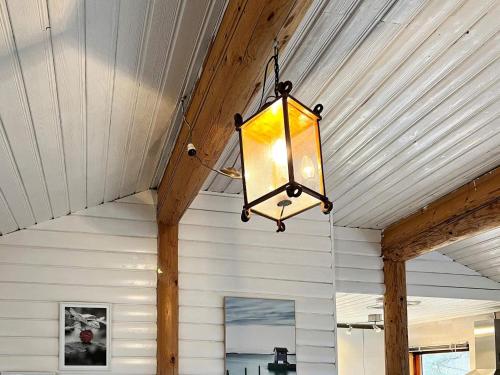 a light hanging from the ceiling of a house at 5 person holiday home in NYNÄSHAMN-By Traum in Nynäshamn