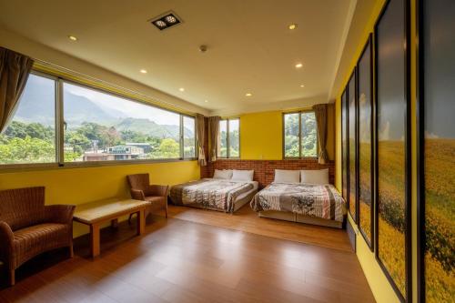 Una cama o camas en una habitación de 溪頭老爺山莊Xitou Royal Villa
