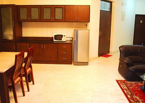 Kuchyň nebo kuchyňský kout v ubytování Silicon Hearth Service Apartments