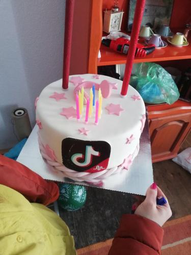 a birthday cake with candles on top of it at Apartmani Feliks in Resavica