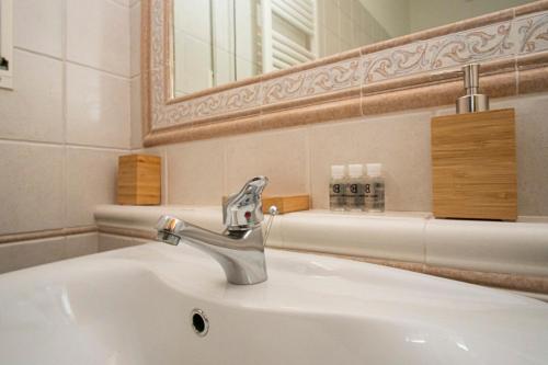 a bathroom sink with a mirror and a sink at Residence La Punta in Marina di Camerota